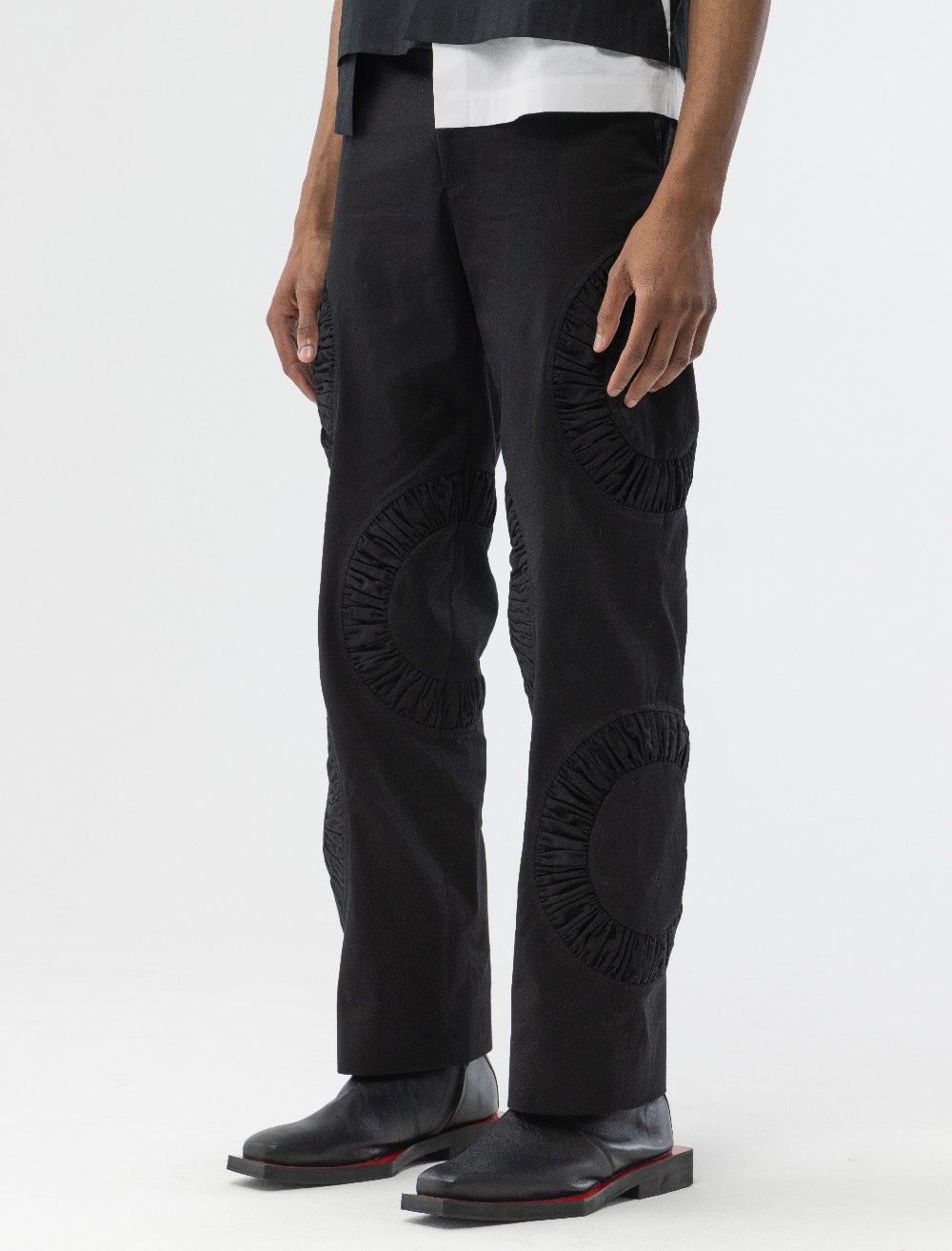 ANICRU Cotton Twill Chino Benny Pant in black, close-up of ruched circular panel 